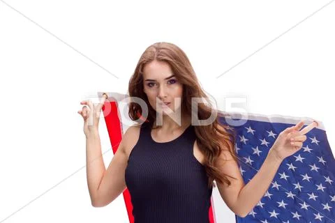 Happy young girl holding USA flag isolated on white background Stock Photos
