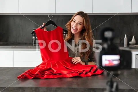 Happy young girl recording her video blog episode Stock Photos