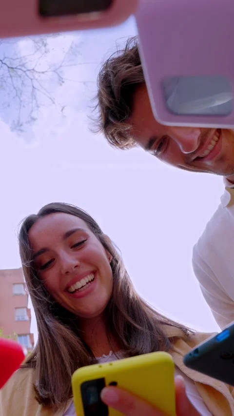 Happy young group of friends using smart mobile phones Stock Footage 279950154