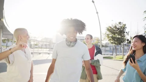 Happy young group of people dancing outdoors. Multiracial Friends having fun Stock Footage 168574674