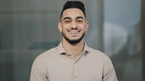 Happy young guy hispanic handsome man with toothy smile looking at camera male Stock-Footage 185957090