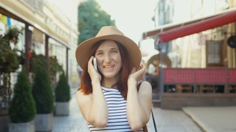 Happy young lady talking on mobile phone Stock Footage 66693850