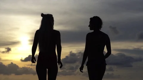 happy young loving lesbians on the beach... | Stock Video | Pond5