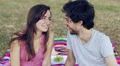 a happy young man and woman laughing at the camera, in the park HD Footage