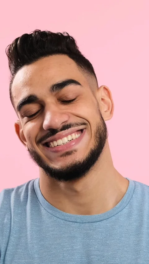 Happy Young Man with Beard Smiling at Camera on Pink Background Stock Footage 326632786