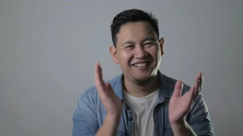Happy Young Man Clapping Hands Stock Footage 143516413