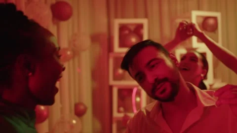 Happy young man dancing with girlfriend doing fun dance moves Video stock 294564917