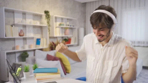 Happy young man dancing at home having fun with funny dance moves. Stock-Footage 222519978
