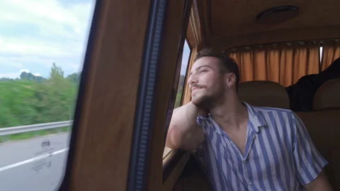 Happy young man looking out of the car. Stock Footage 212400236