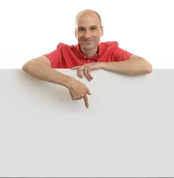 Happy young man pointing at empty board Stock Photos