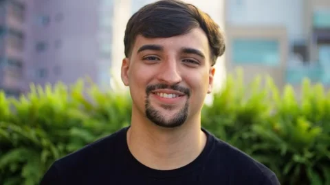 Happy young man smiling cheerfully looking at camera close up video portrait. Stock Footage 265196989