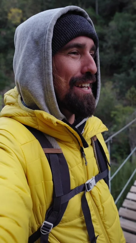 Happy young man smiling looking at camera and landscape standing on wooden Stock Footage 275165840