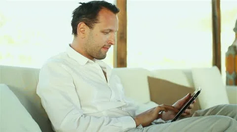 Happy young man with tablet computer  HD Stock Footage 10901832