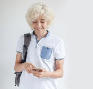 Happy young man talking of mobile phone Stock Photos