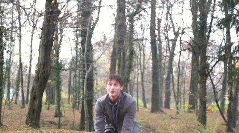 Happy young man throwing leaves in the air Stock Footage 59553891
