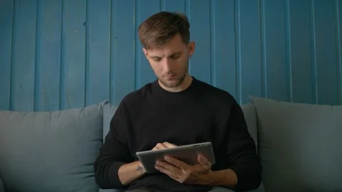 Happy Young Man Using Digital Tablet Ipad Computer In Cafe Stock Footage 97580106