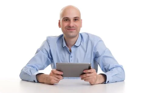 Happy young man using digital tablet Stock Photos