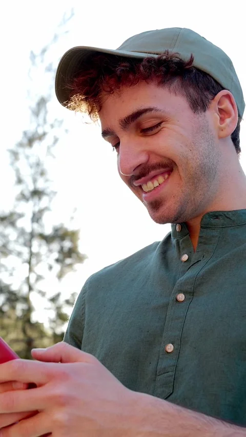 Happy young man using mobile phone at city street. Stock Footage 281151265