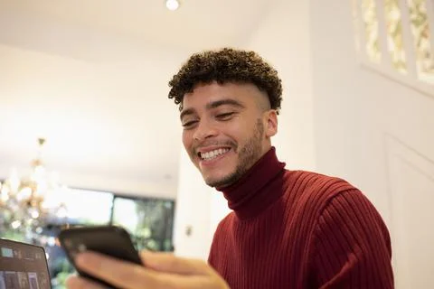 Happy young man using smart phone 스톡 사진