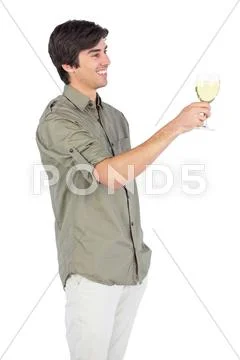 Happy young man with wine glass Stock Photos