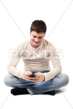 Happy young man writes a message Stock Photos