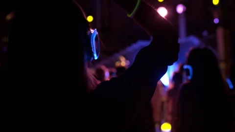 Happy young people are dancing and having fun at silent disco party Stock Footage