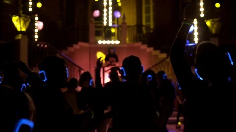 Happy young people are dancing and having fun at silent disco party Stock Footage 107742017