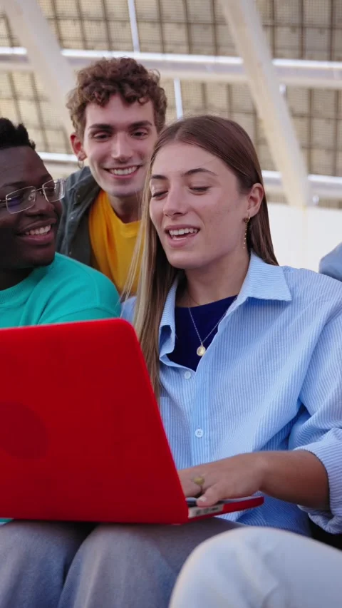Happy young people are sitting quietly on stairs smiling using their mobile Stock Footage 269242584