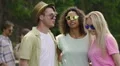 Happy young people enjoying music at outdoor party, dancing and taking selfie HD Footage