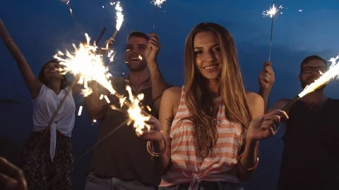 Happy Young People with Sparklers Stock Footage