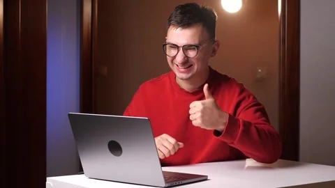 Like. Happy young programmer freelancer man with glasses working on laptop Stock Footage 263595366