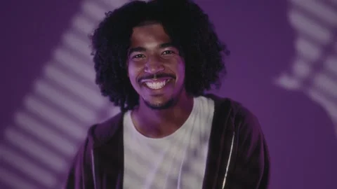 Happy young programmer smiling in front of world map projection Stock Footage 317922090