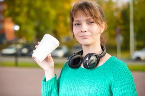 Happy young student girl drinking take away coffee Stock Photos