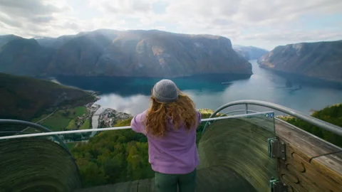 Happy young travel blogger woman run in epic view Stock Footage 242032521