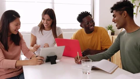 Happy young university students studying with laptop and tablet at home. Stock Footage 250654853