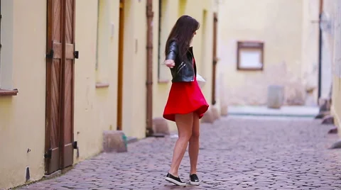 Happy young urban woman in european city on old streets. Caucasian tourist Stock Footage