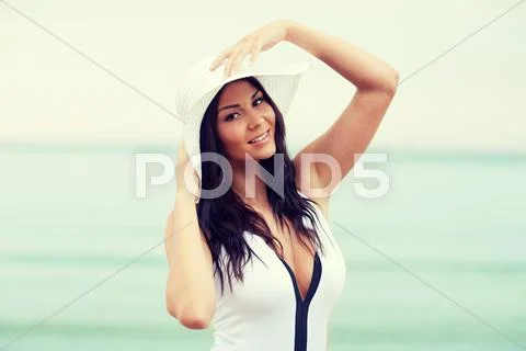 Happy young woman on beach Stock Photos