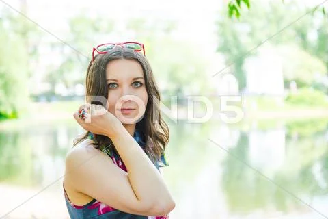 Happy young woman outdoors Stock Photos