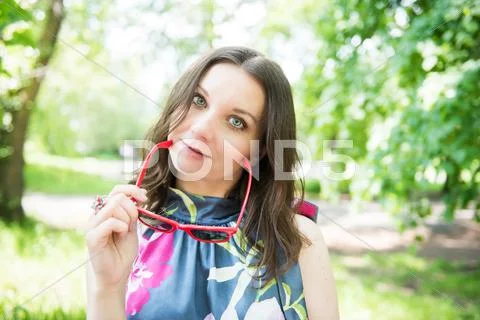 Happy young woman outdoors Stock Photos
