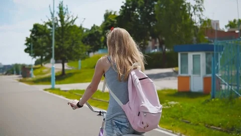 Happy Young Woman Smiling Laughing Riding Bicycle Slow Motion Stock Footage