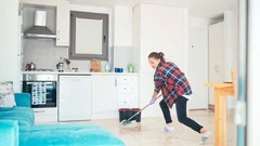 Young Woman Doing Housework And Cleaning. Attractive Girl Mopping