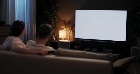 Hapy siblings having nostalgic night in watching old classic singing along to Stock Footage 263610251