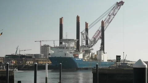 Harbor Activity: Loading a Massive Container Ship in Oostduinkerke Stock Footage 253037113