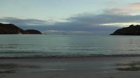 Harbor after the sunset, wave coming and going, calm warm idyllic ocean Stock Footage 202118217