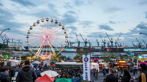 Harbor and funfair with ferris wheel in the evening timelapse Video stock 50083531