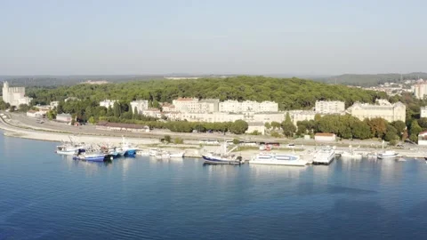Harbor and Train Yard landscape, aerial circling Stock Footage 133356689
