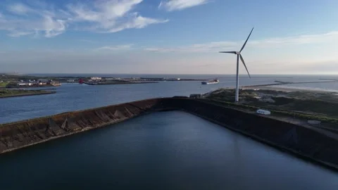Harbor basin with cargo vessel and wind turbines Stock Footage 342682086