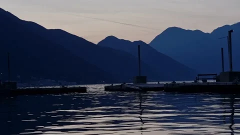 Harbor between mountains sunset shot Stock Footage 236918488