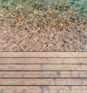 Harbor board and deck path made of wood with sea shore background Stock Photos