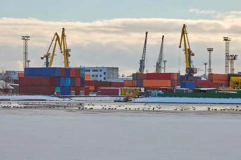Harbor cranes, container ship terminal, cargo container yard Stock Photos